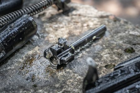 The shutter of the AK 74 submachine gun in disassembled condition during cleaning of the weapon.